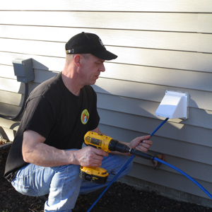 man cleaning a dryer vent