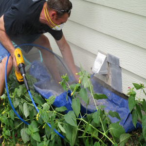 man cleaning a dryer vent